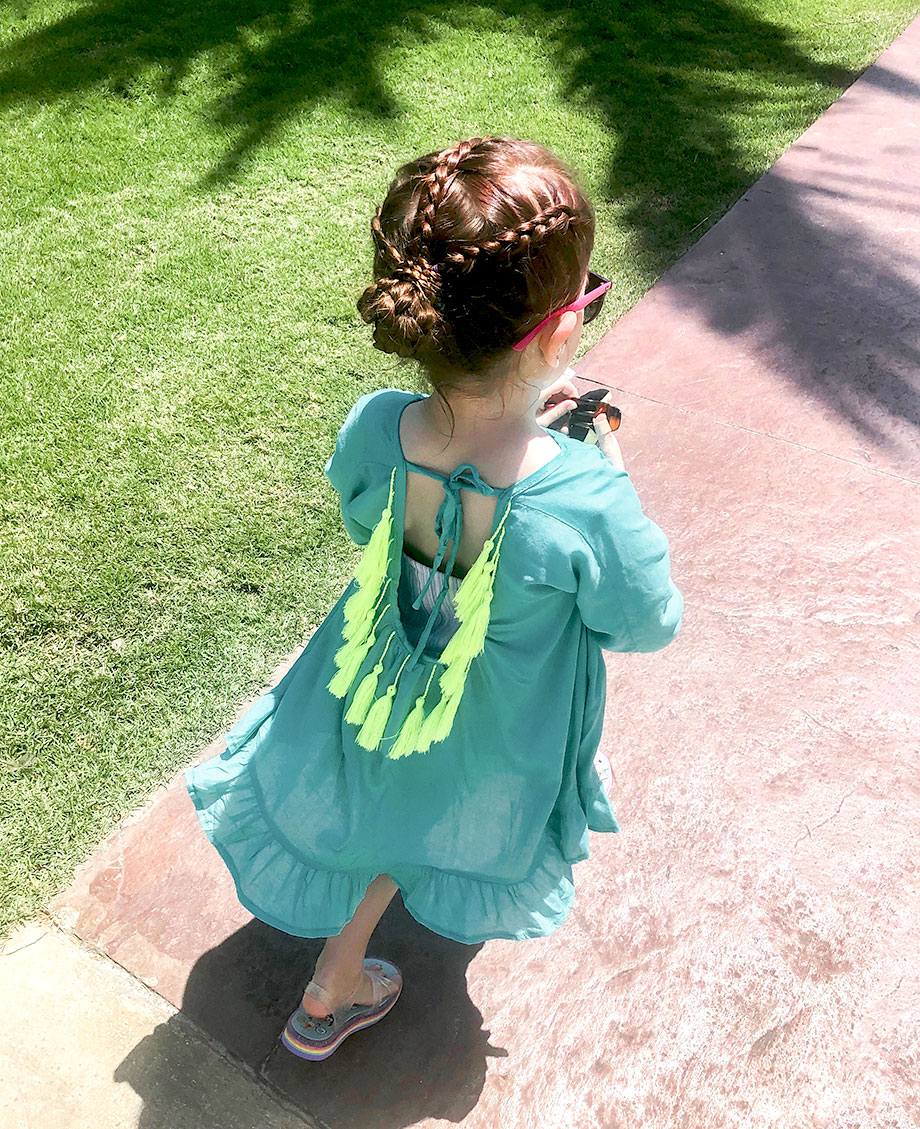Zelda of Glitter and Bubbles wears vacation braids and a swimsuit cover up.